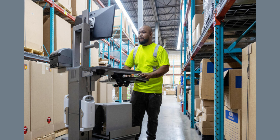 Man in warehouse with mobile workstation